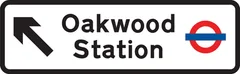 Junction ahead leading to a London underground railway station — UK road sign