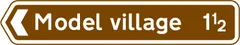 Direction and distance to a tourist attraction — UK road sign