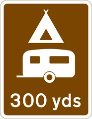 Camping and caravan site 300 yards ahead — UK road sign