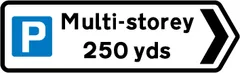 Direction and distance to a multi-storey parking place — UK road sign