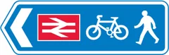 Direction of route to railway station for pedestrians and pedal cycles — UK road sign