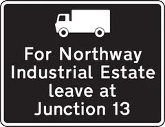 Exit from a motorway junction ahead that should be used for a destination along the route advised for goods vehicles — UK road sign