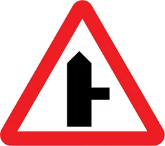 Side road ahead (right) — UK road sign