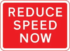 Reduction in speed necessary for a change in road layout ahead — UK road sign