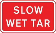 Vehicular traffic should proceed slowly owing to temporary hazard resulting from wet tar on the road — UK road sign