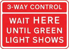 Vehicles may not pass the temporary traffic signals when the red light is shown at a junction — UK road sign