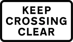 Vehicular traffic must not stop within the area of a railway or tramway level crossing — UK road sign