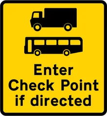 Goods vehicles and buses may be directed to enter a check point ahead — UK road sign