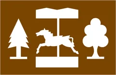 Tourist symbol for England and Wales: peasure or theme park — UK road sign